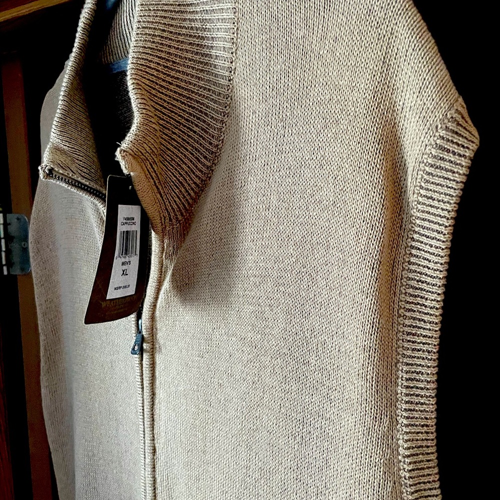 Zip up sweater vest great for fall weather.